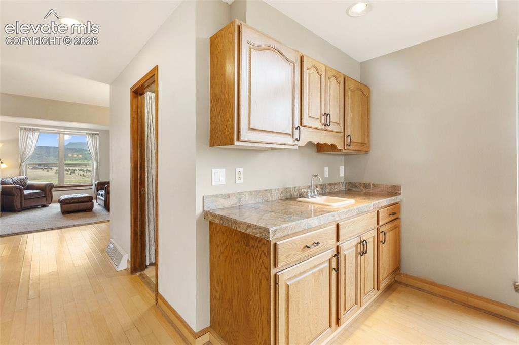 Image 39 of 50: Living room wet bar- perfect for entertaining!