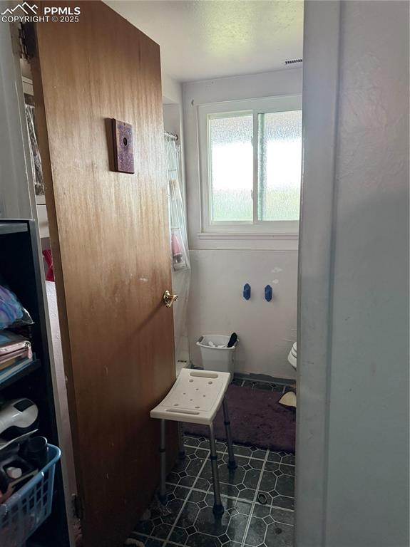 Image 8 of 10: Bathroom with toilet