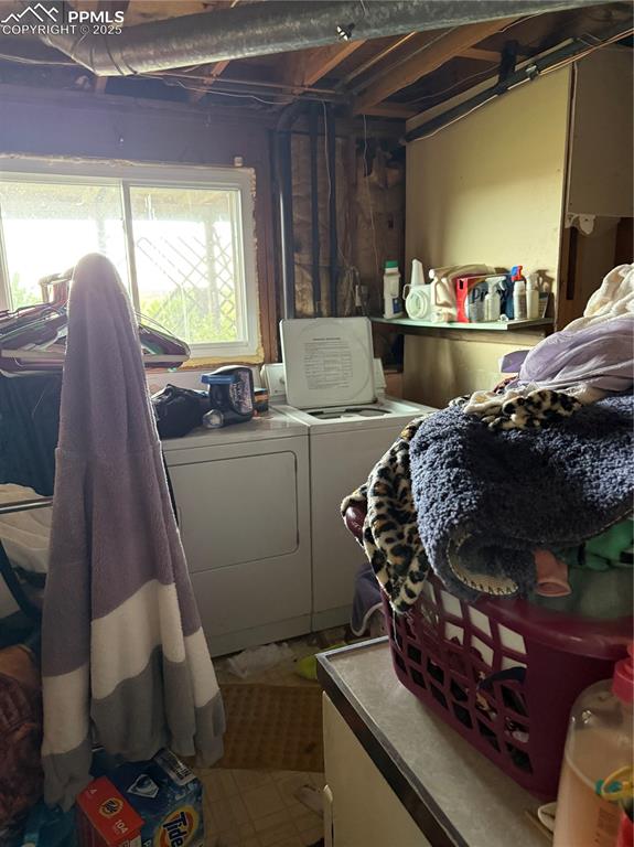 Image 9 of 10: Washroom with washer and clothes dryer