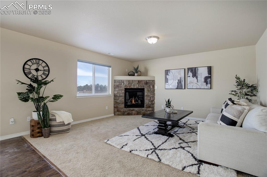 Image 5 of 23: Family room w/ gas fireplace