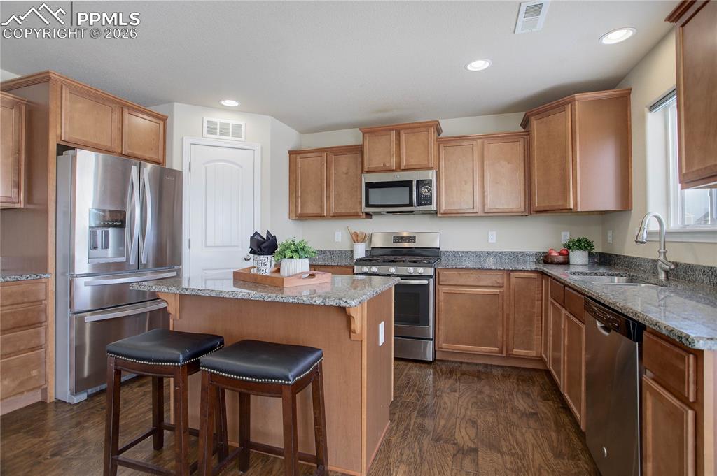 Image 8 of 23: SS Appliances & walk-in pantry