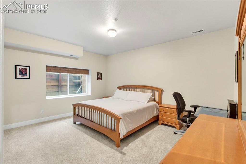 Image 42 of 49: Basement Bedroom