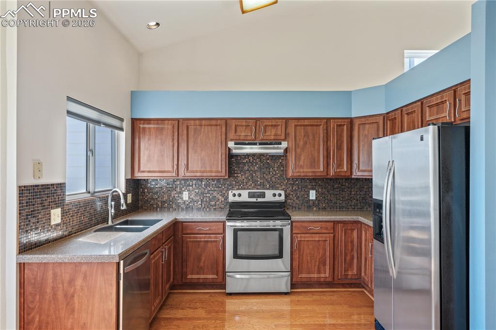 Image 11 of 43: nviting entry with bright lighting, tile flooring at entry, carpet througho