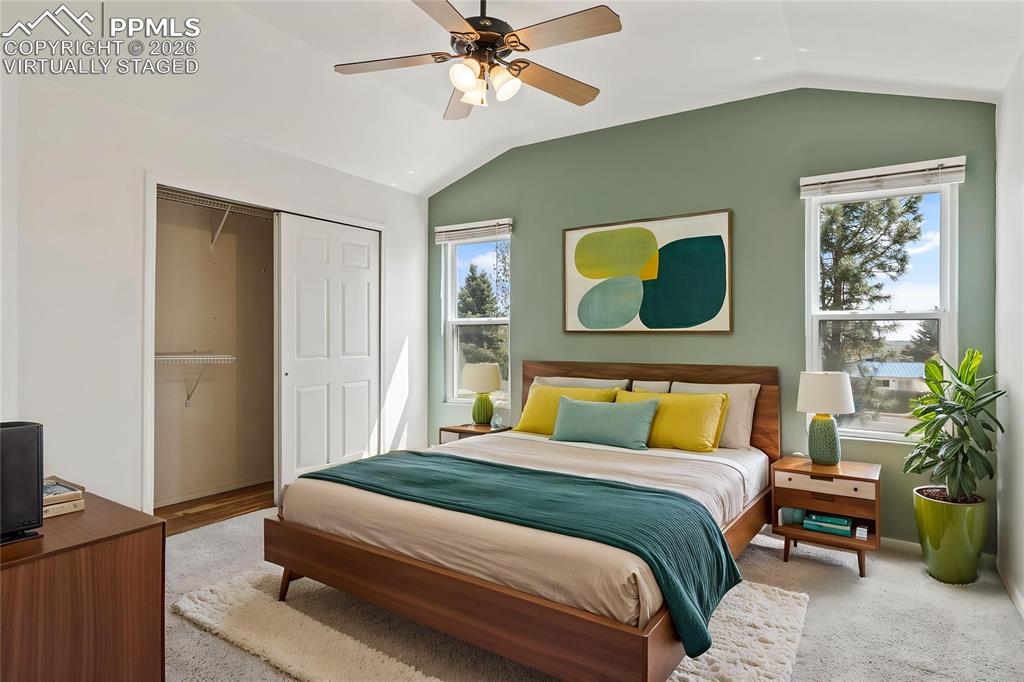 Image 19 of 43: Kitchen with hardwood floors, stainless steel appliances and open flow to b