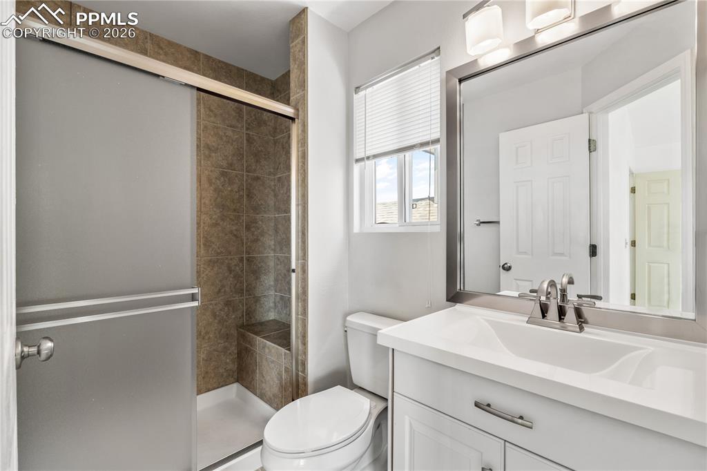 Image 22 of 43: Kitchen with hardwood floors, stainless steel appliances and open flow to b
