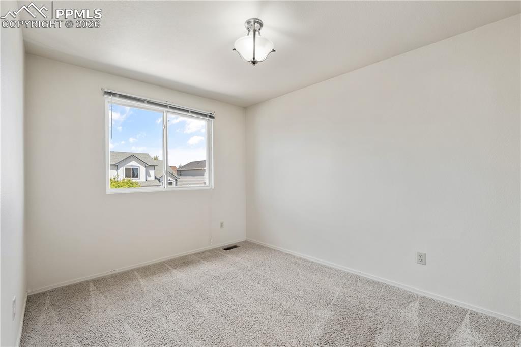 Image 23 of 43: Family room, large bright windows, cozy gas fireplace, open space for enter