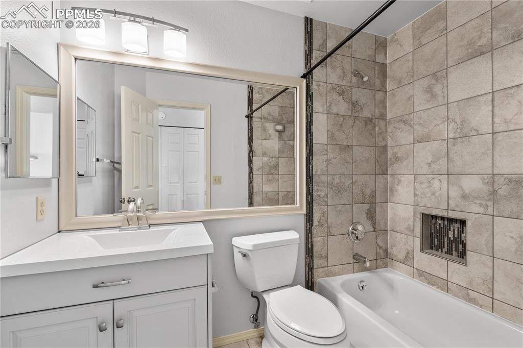 Image 25 of 43: Easy access from dining room, carpet flooring throughout, open space for en