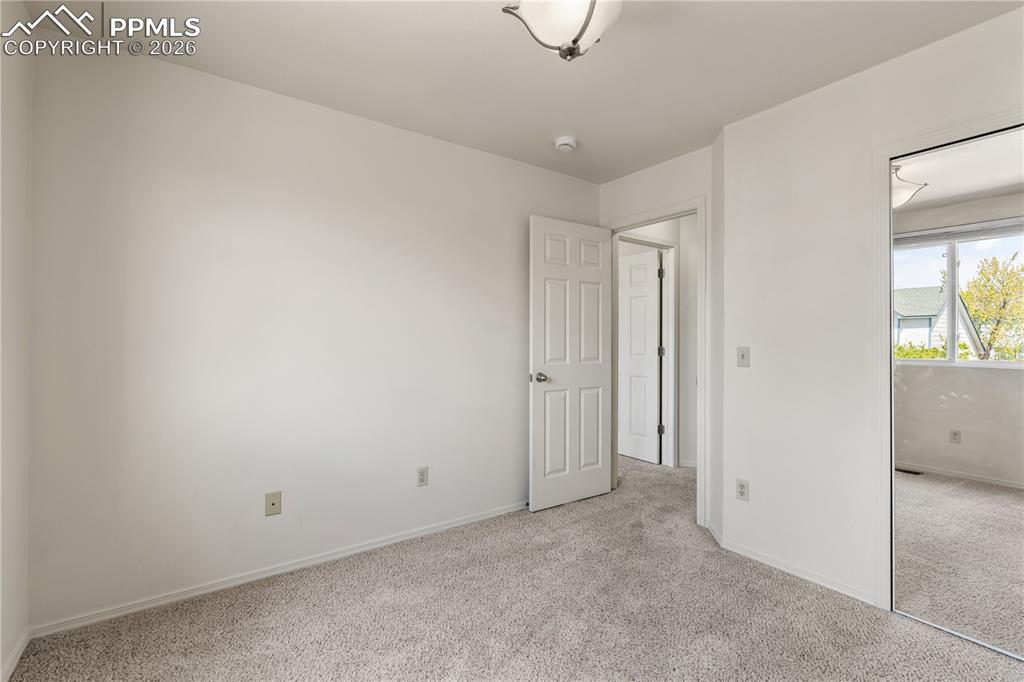 Image 27 of 43: Stairway access to the top floor, hardwood flooring