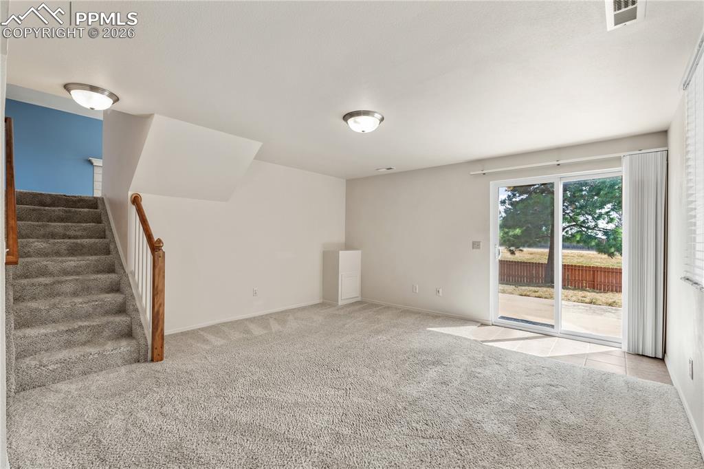 Image 28 of 43: Virtually Staged
Bright, warm and inviting, ceiling fan, carpet throughout