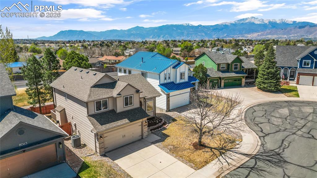 Image 36 of 43: Bedroom with large window for natural light, carpet throughout and closet s