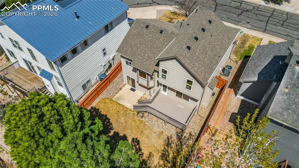 Image 37 of 43: Bedroom with large window for natural light, carpet throughout and closet s