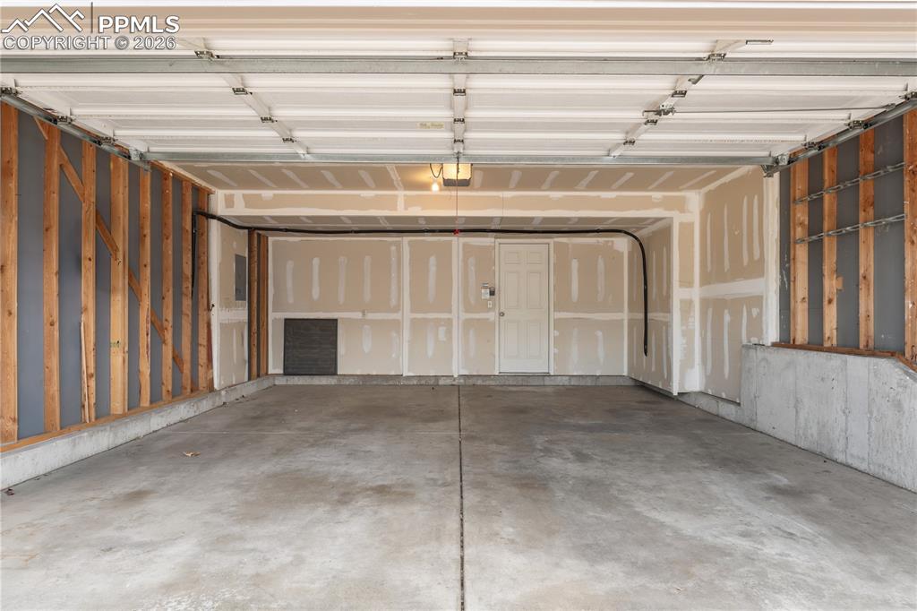 Image 38 of 43: Basement/recreation room, access to outside patio, windows and glass slidin