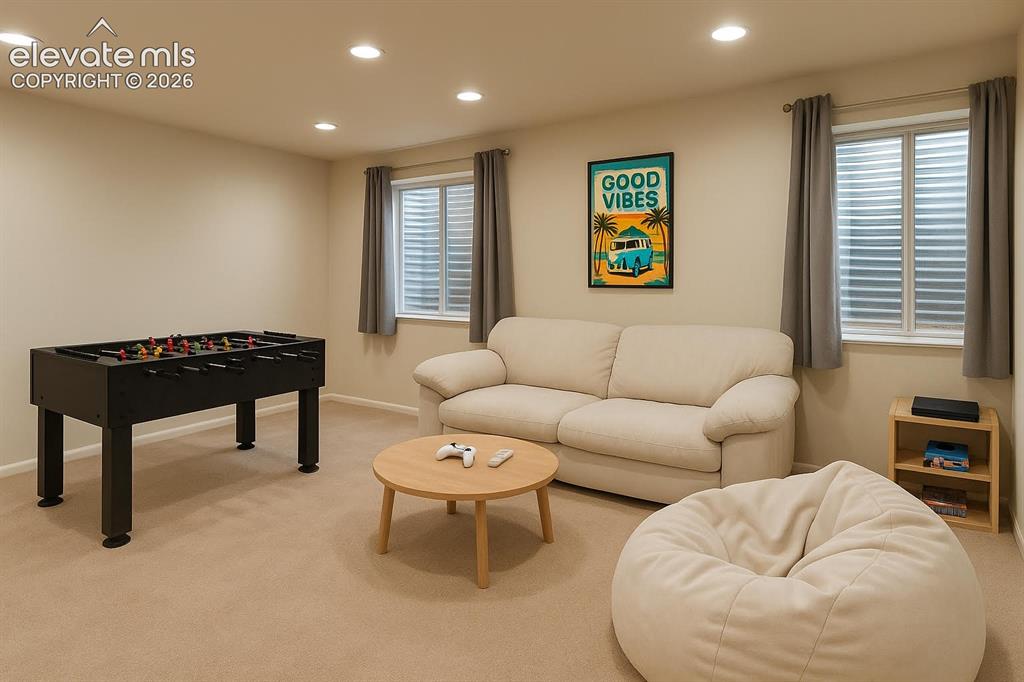 Image 11 of 15: Recessed ceiling lighting, two windows with blinds, and neutral-toned wall 