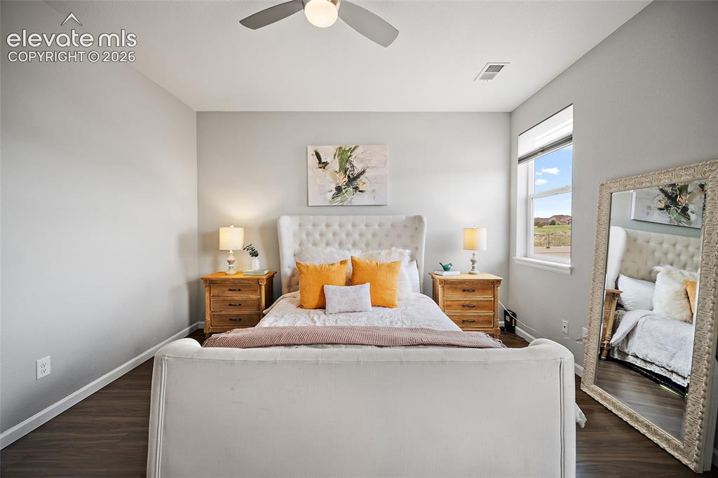 Image 19 of 38: Bedroom featuring wood-finish flooring, a ceiling fan with integrated light