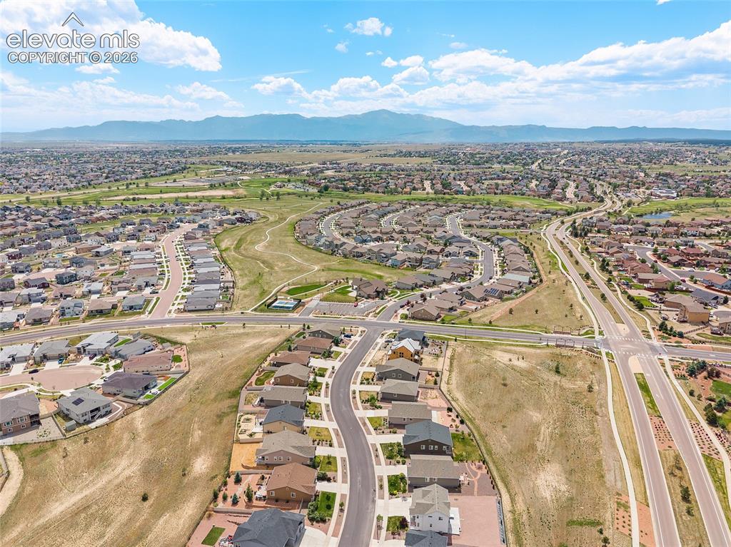 Image 36 of 38: Expansive aerial perspective showcasing a residential development with mult