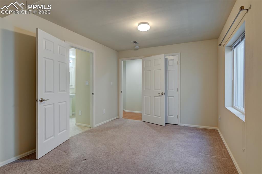 Image 39 of 47: Bedroom 5 Located in the Basement with adjoining Bathroom.