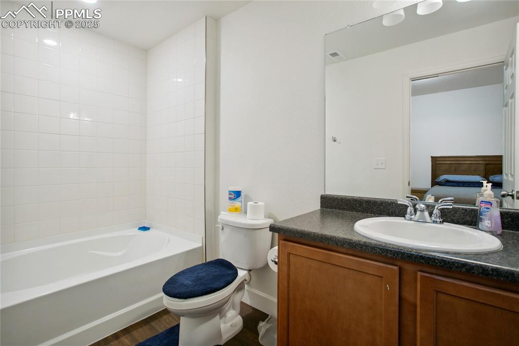 Image 41 of 49: Bathroom featuring bathtub / shower combination, visible vents, toilet, van