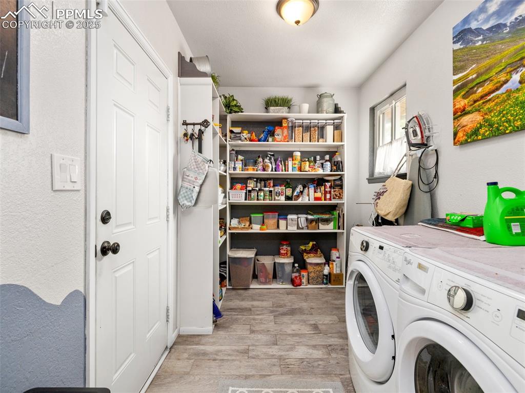 Image 14 of 50: Laundry and pantry off of kitchen