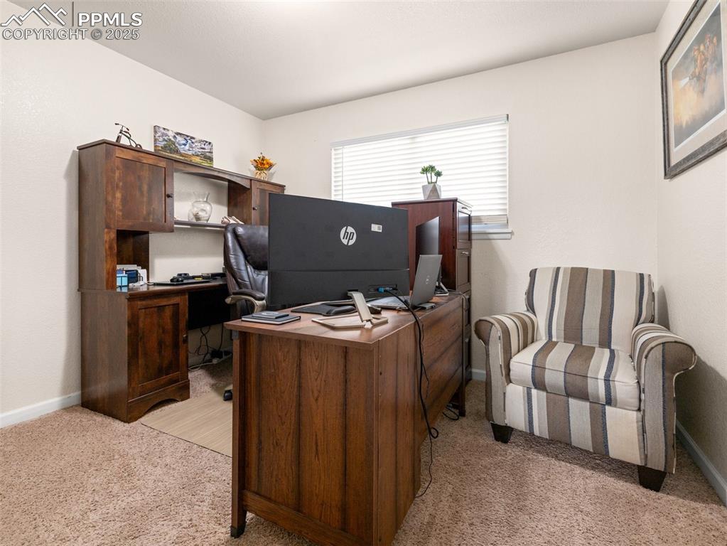 Image 18 of 50: Main floor guest bedroom being used as office