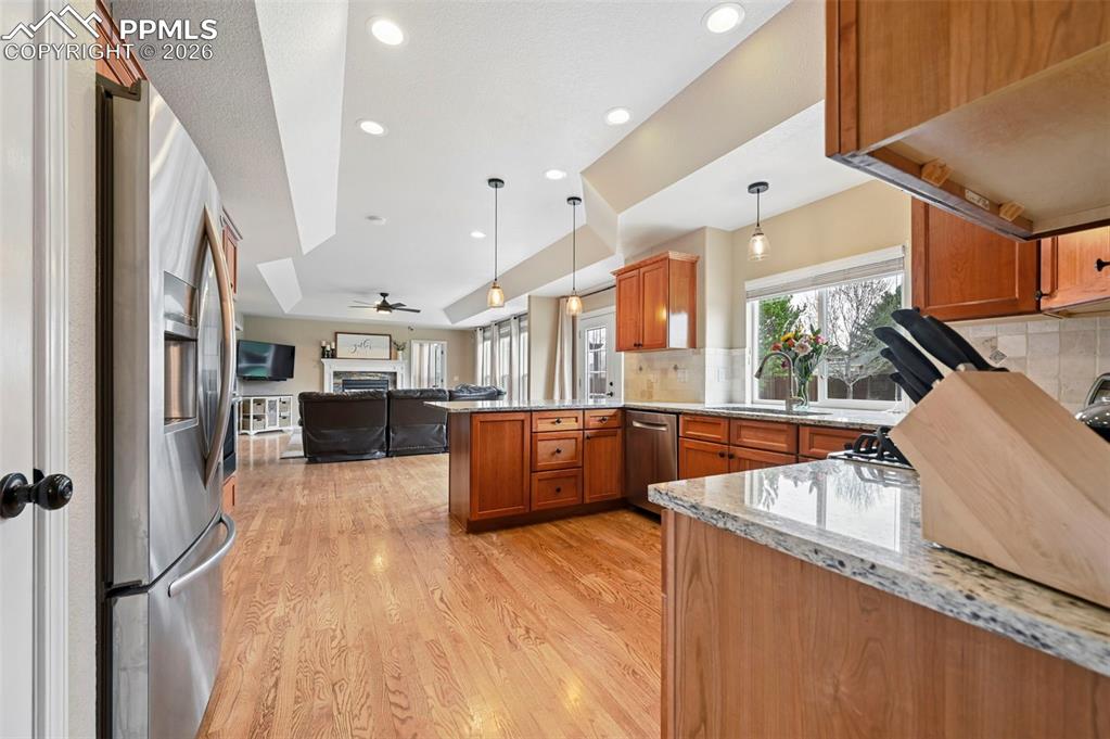 Image 11 of 44: Open kitchen with ample cabinetry and functional workspace