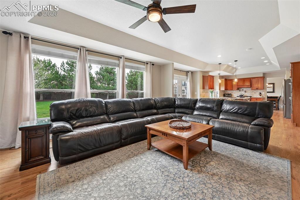 Image 17 of 44: Warm and inviting living space centered around a see-through fireplace