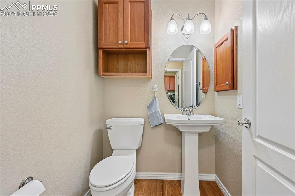 Image 21 of 44: Well-placed main-level bath for guests and daily convenience