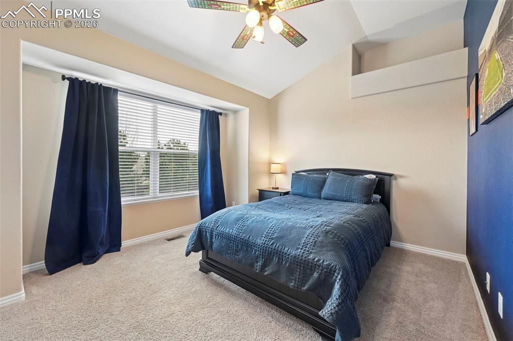 Image 29 of 44: Bright secondary bedroom with natural light and flexible use