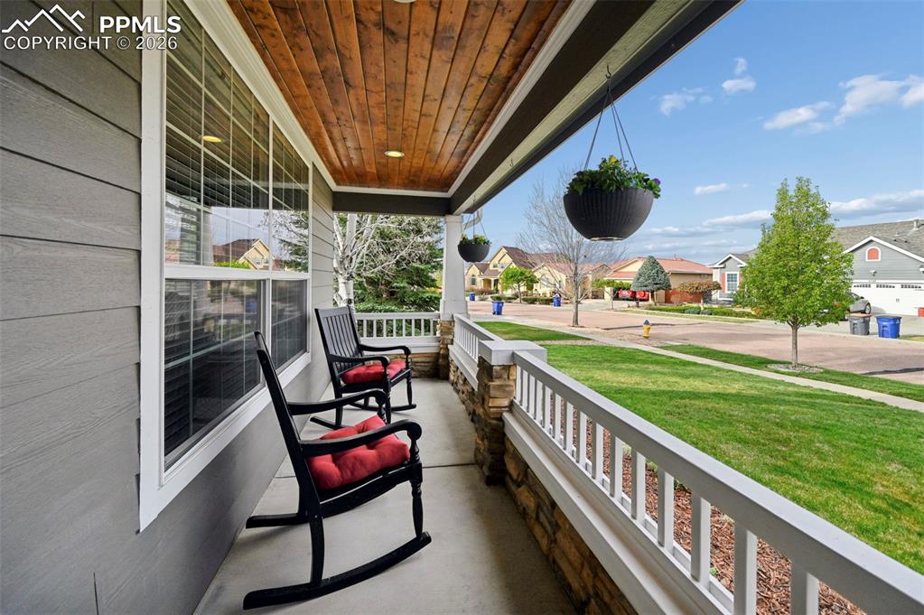 Image 3 of 44: Relax on the covered front porch—perfect for morning coffee or evening conv