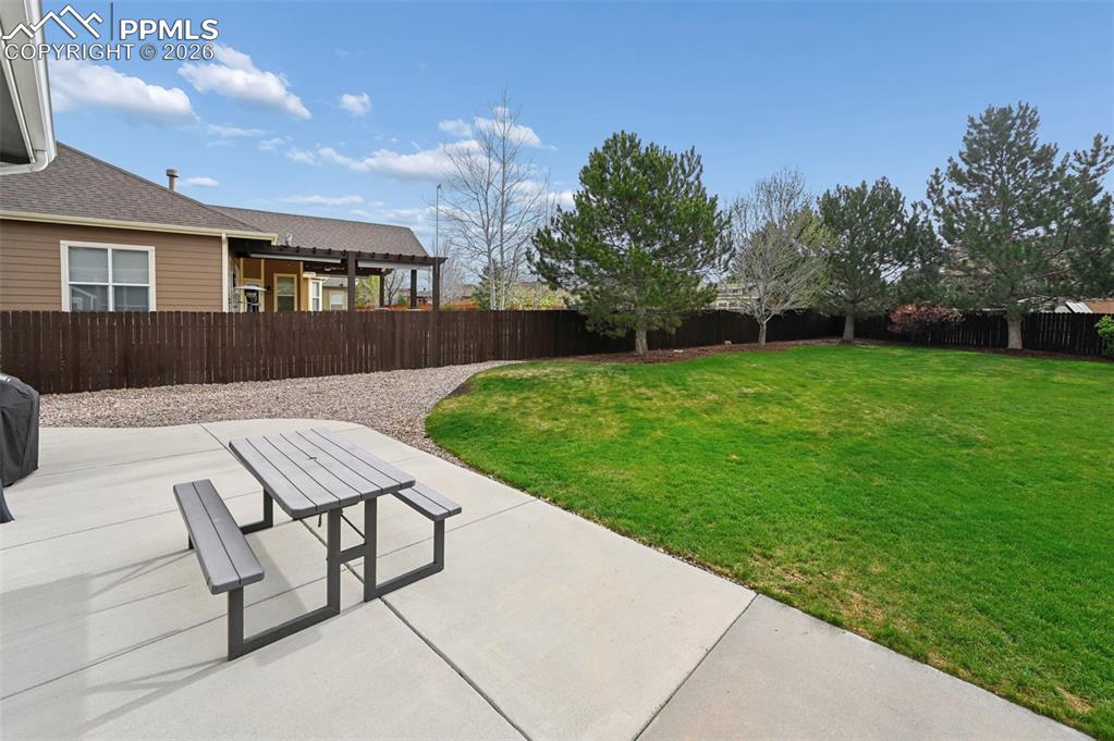 Image 39 of 44: Large backyard offering space, privacy, and room to enjoy