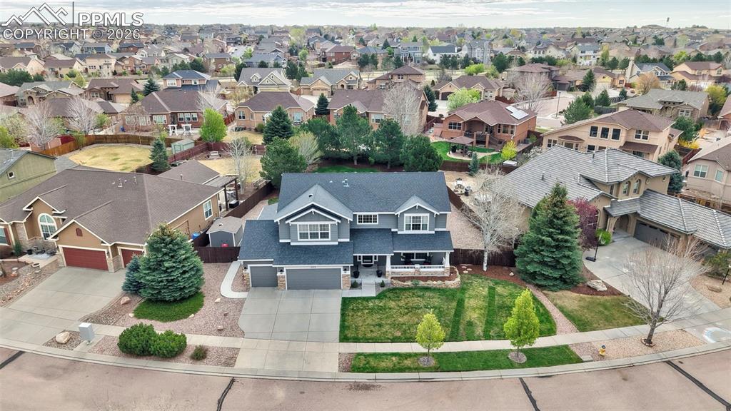 Image 4 of 44: Aerial view showcasing lot size, positioning, and surrounding homes