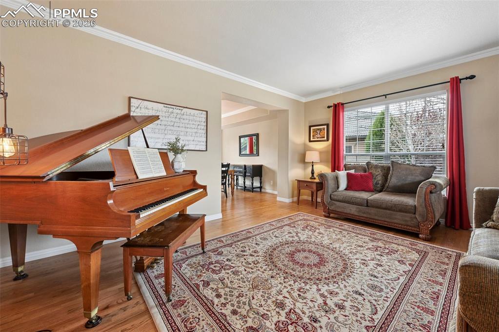 Image 8 of 44: Front living space ideal for entertaining, music, or a quiet sitting area