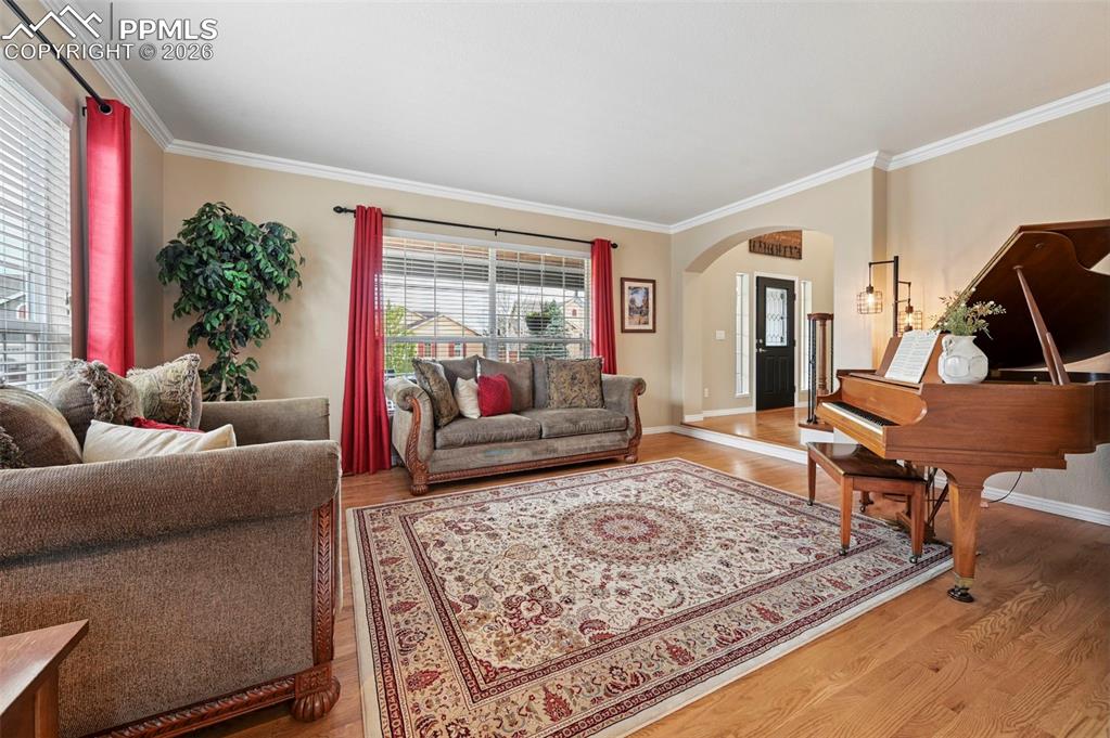 Image 9 of 44: Flexible front living area with natural light and versatile use