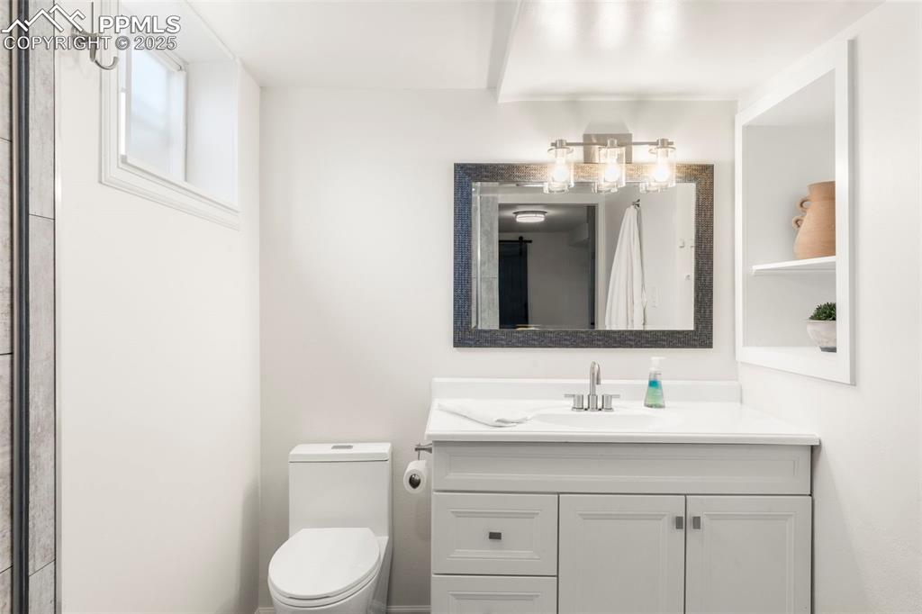 Image 21 of 30: Bathroom with vanity and toilet
