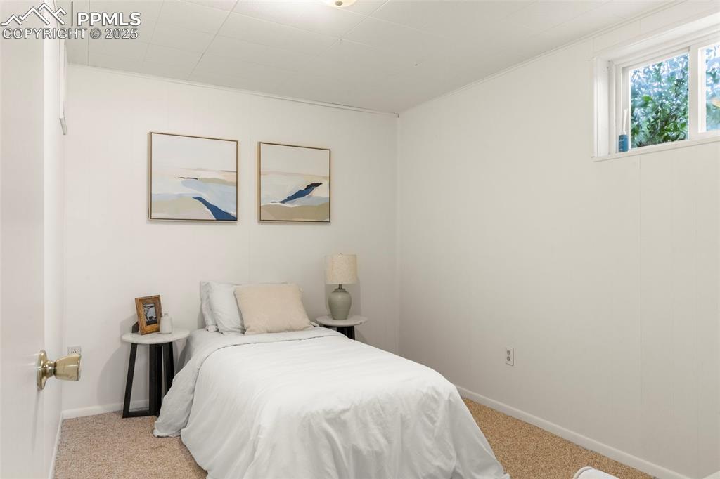 Image 23 of 30: Bedroom featuring light colored carpet and baseboards