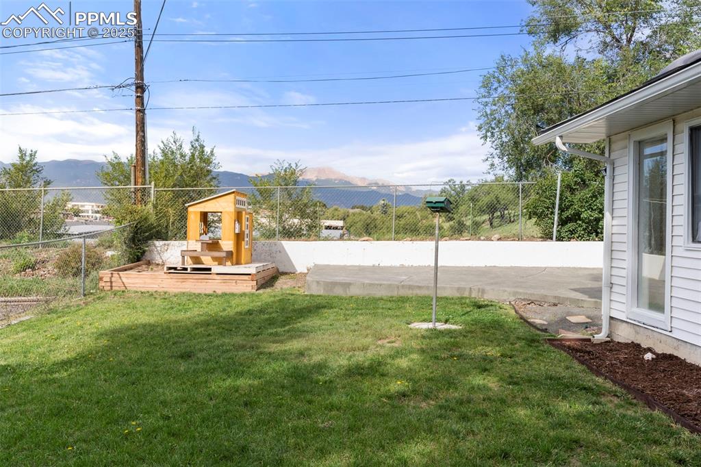 Image 25 of 30: View of yard featuring a mountain view and a patio area