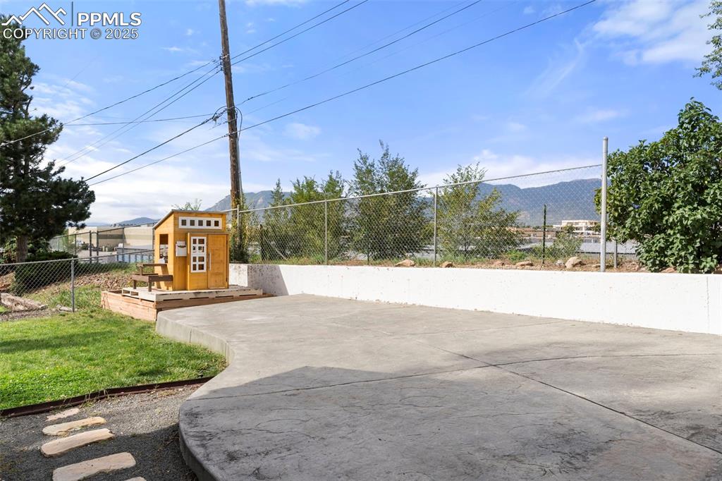 Image 26 of 30: View of community with a mountain view and a playground