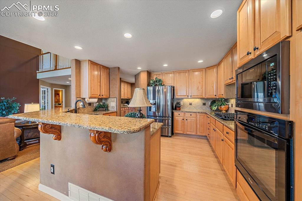 Image 10 of 50: Gourmet Kitchen, with Granite Countertops, Stainless Steel Appliances, Gas 