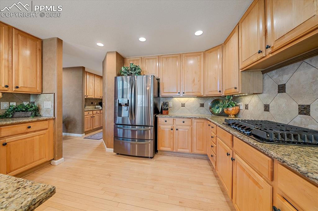 Image 12 of 50: Gourmet Kitchen, with Granite Countertops, Stainless Steel Appliances, Gas 