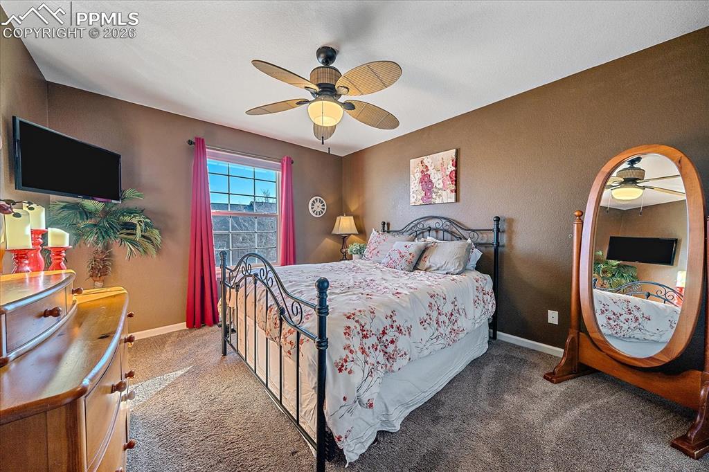 Image 26 of 50: Bedroom 3 with ceiling fan