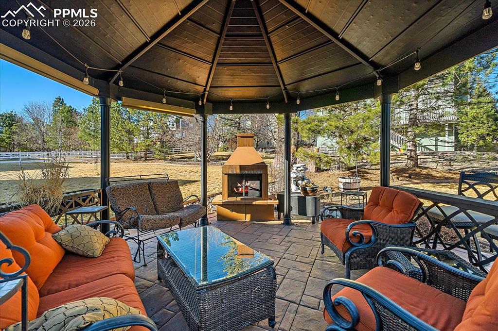 Image 43 of 50: Gazebo with Fireplace