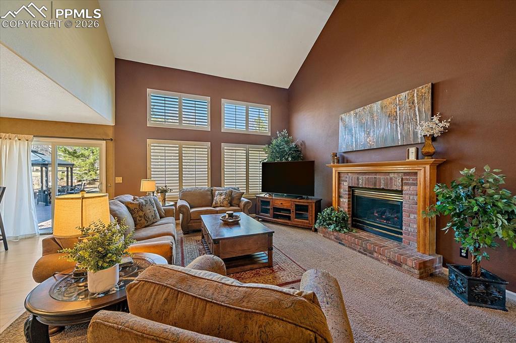 Image 5 of 50: Great Room/Living Room with Fireplace