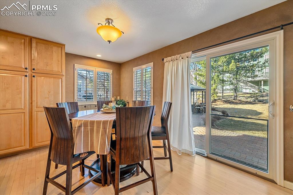 Image 9 of 50: Breakfast Nook overlooking Backyard