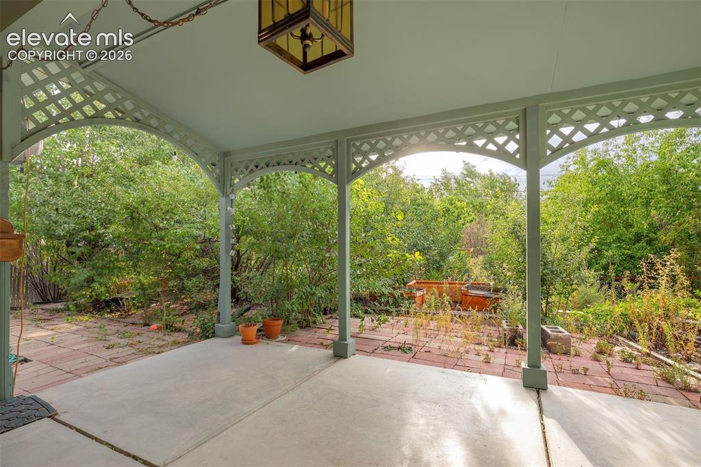 Image 10 of 11: Lovely covered back patio.