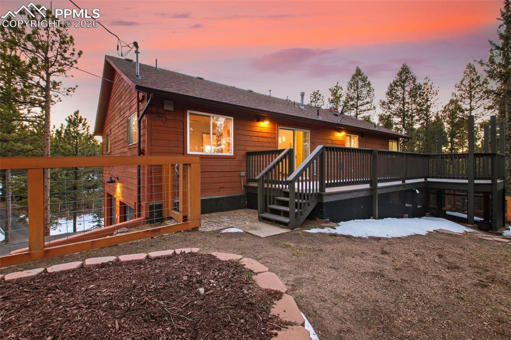 Image 25 of 28: Expansive Woodland Deck Retreat