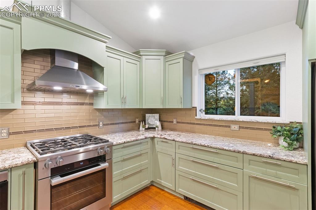 Image 7 of 28: Designer Kitchen with Island