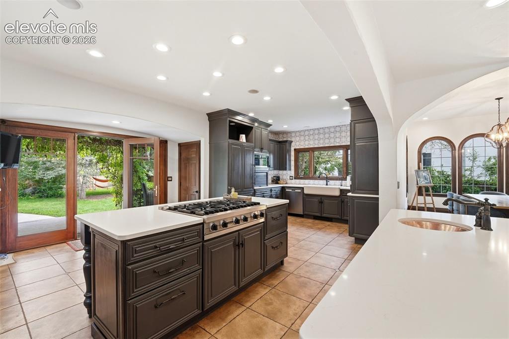Image 10 of 50: Gourmet kitchen with walkout to back yard, dual islands, built in desk and 