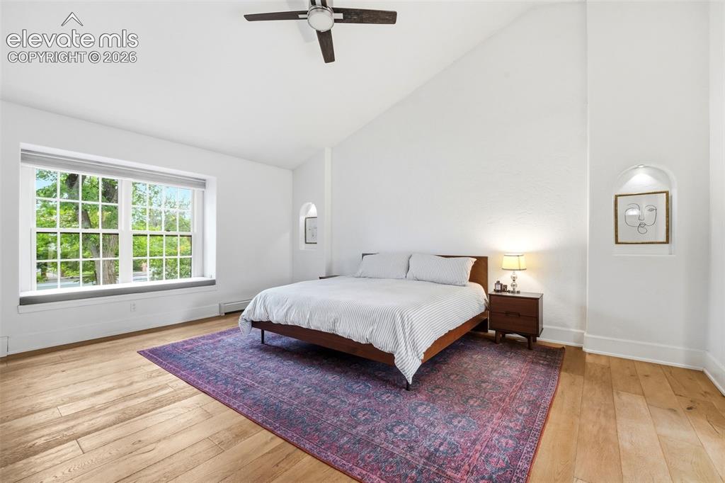 Image 18 of 50: Very large primary bedroom with lots of natural light
