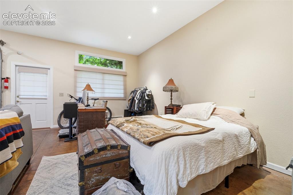 Image 39 of 50: Room featuring light-toned walls, recessed lighting, and wood-finish floori