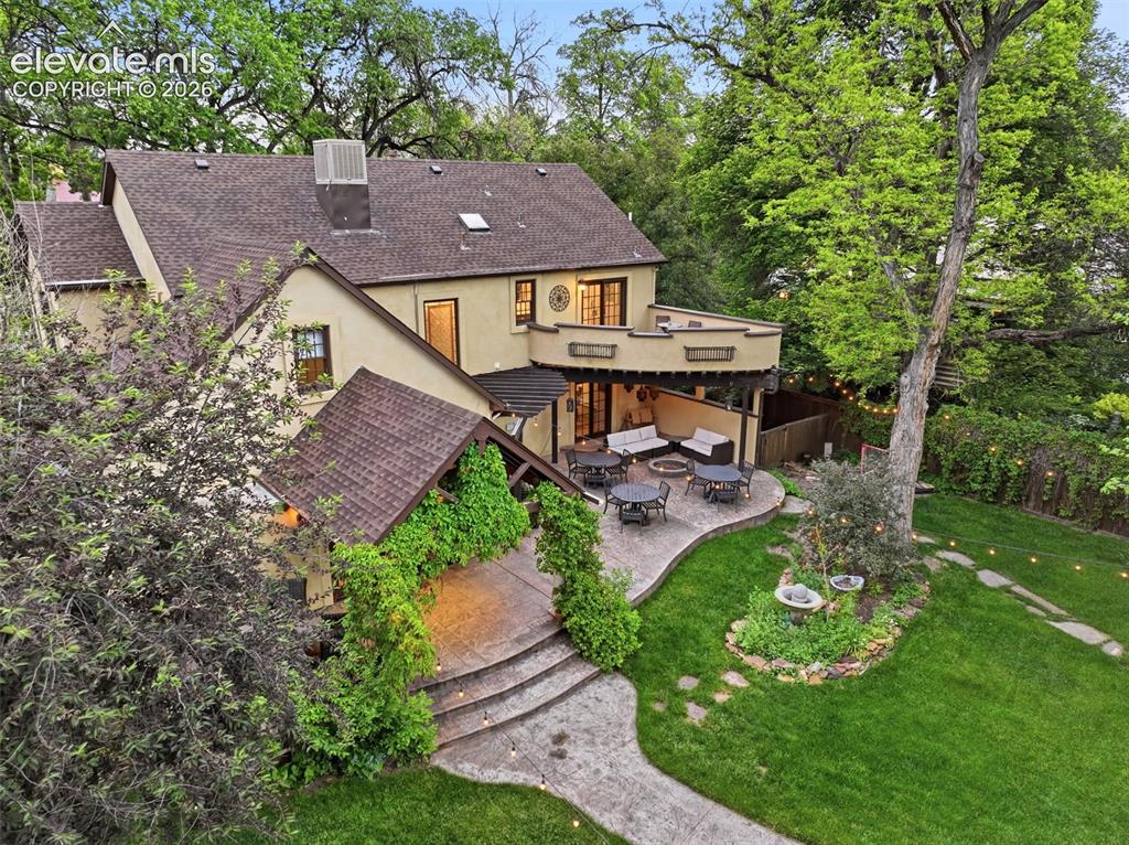 Image 5 of 50: Expansive private outdoor living space featuring a second-story balcony, co