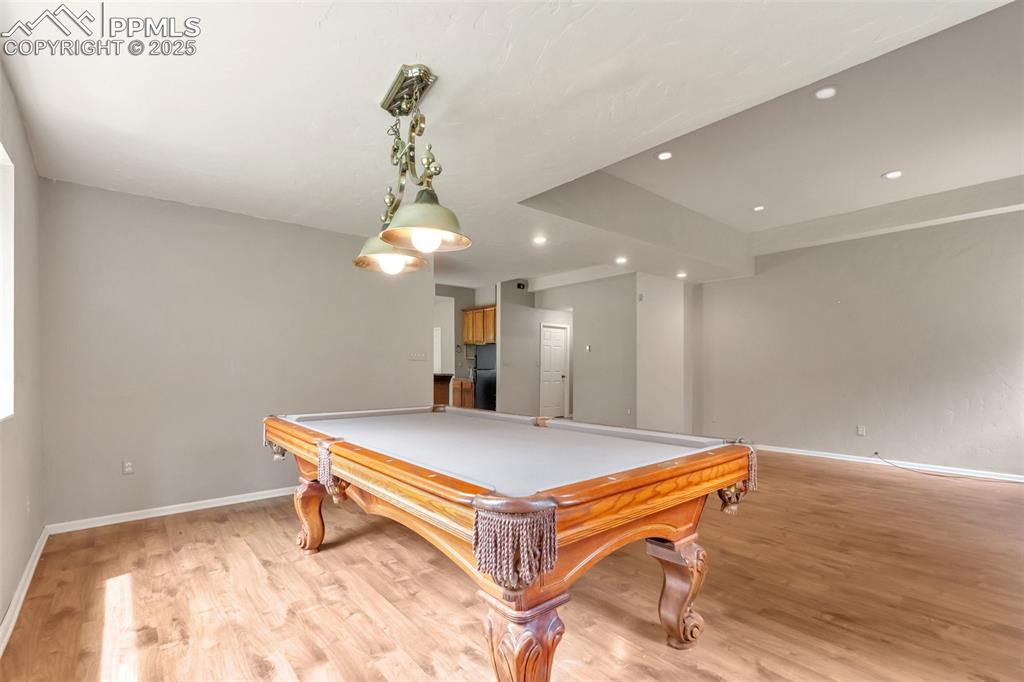 Image 28 of 31: Game room with billiards table, recessed lighting, and light wood finished 